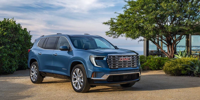 Front view of blue 2026 GMC Acadia SUV at Don Johnson Motors GMC Rice Lake, WI