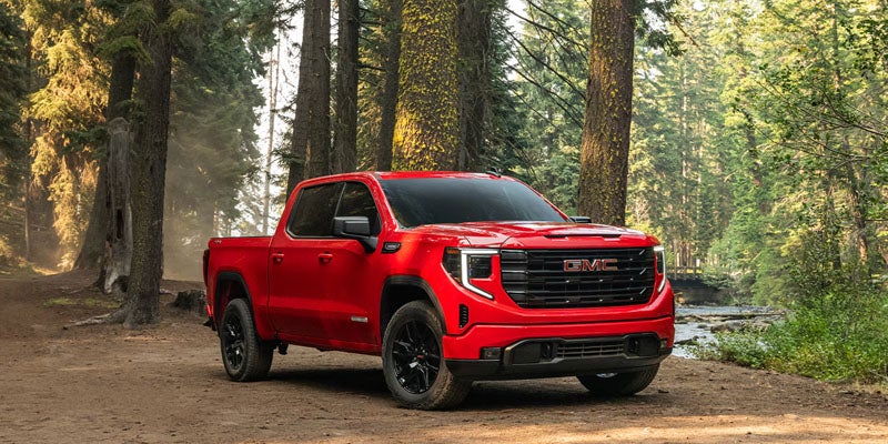 Red 2026 GMC Sierra 1500 parked outdoors at Don Johnson Motors GMC Rice Lake